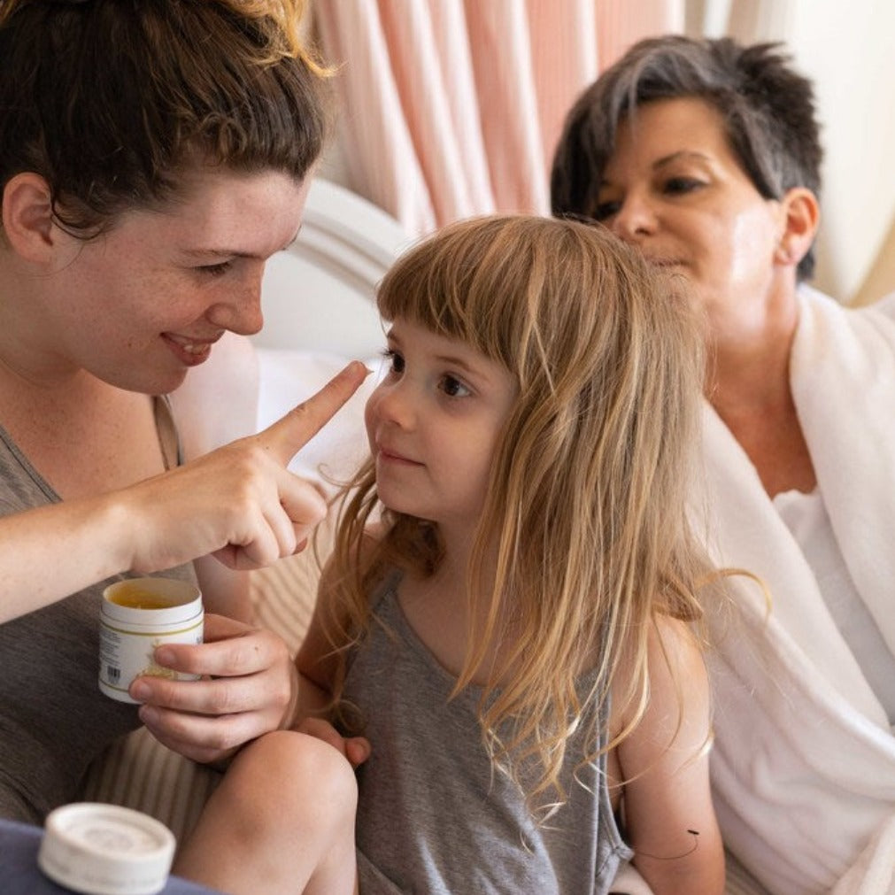 Mother applying Bubbles & Balms&