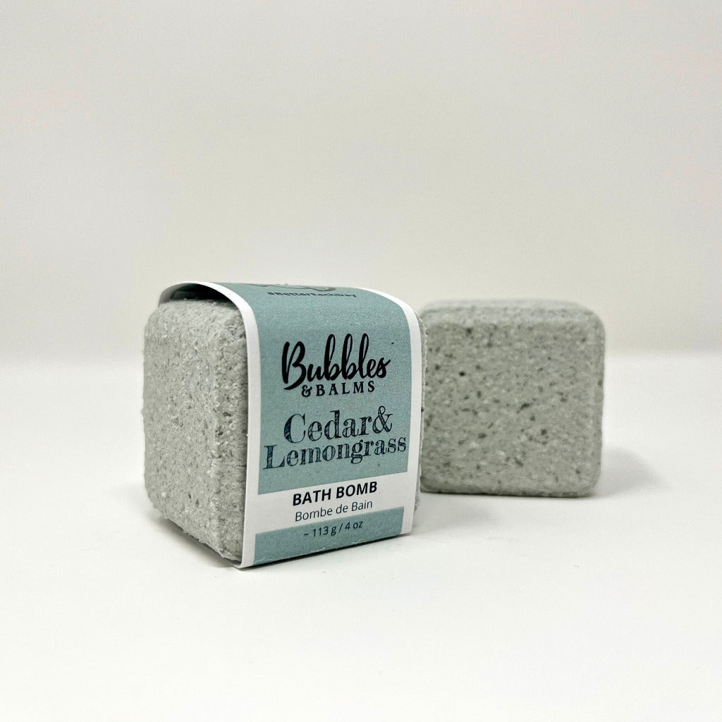 Bubbles &amp; Balms Cedar &amp; Lemongrass Fizzy Bath Bomb with label and nude