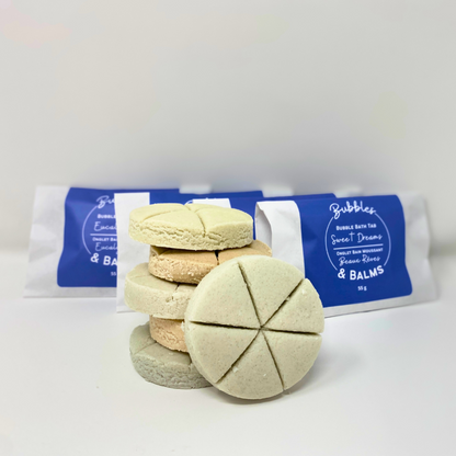 Bubbles &amp; Balms solid bubble bath tabs for dry &amp; sensitive skin with packaging in behind and bubble bath tab facing outwards with its 6 sections for mix &amp; match aromas.