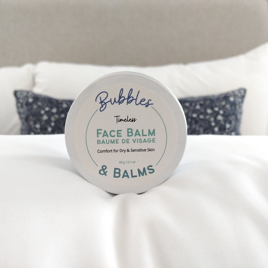 Bubbles &amp; Balms Vegan and All Natural Timeless Night Cream featuring Rosehip Oil in jar about to be opened to nourish dry skin.