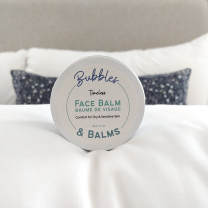 Bubbles &amp; Balms Vegan and All Natural Timeless Night Cream featuring Rosehip Oil in jar about to be opened to nourish dry skin.